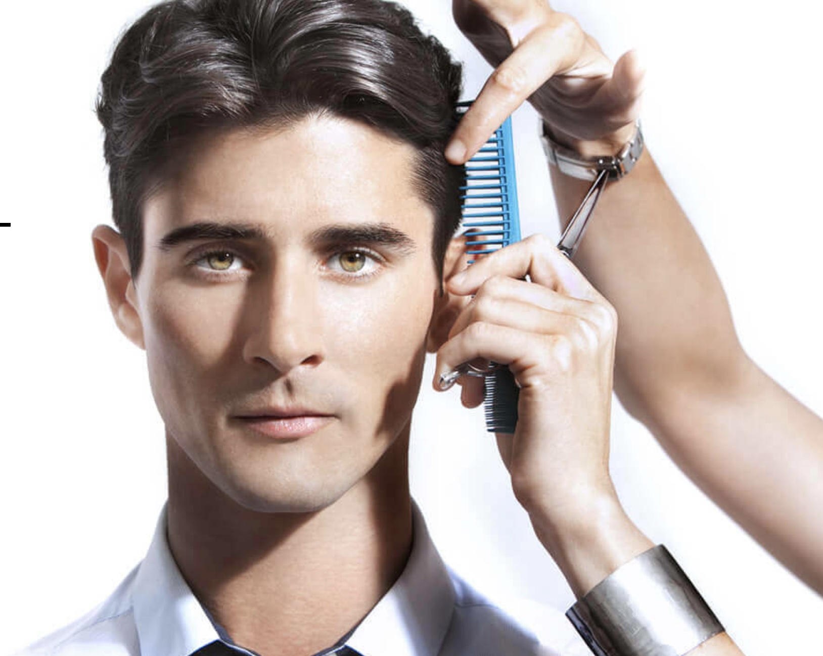 Man getting a haircut with scissors and comb